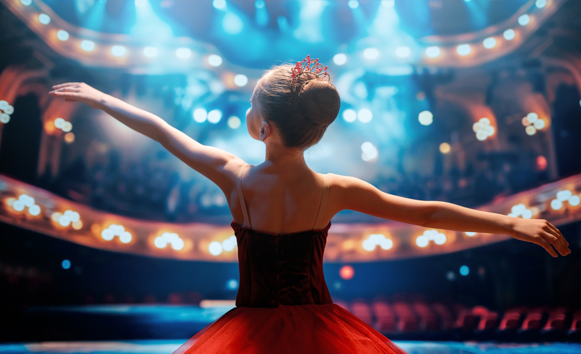 girl in a red tutu dancing on the stage